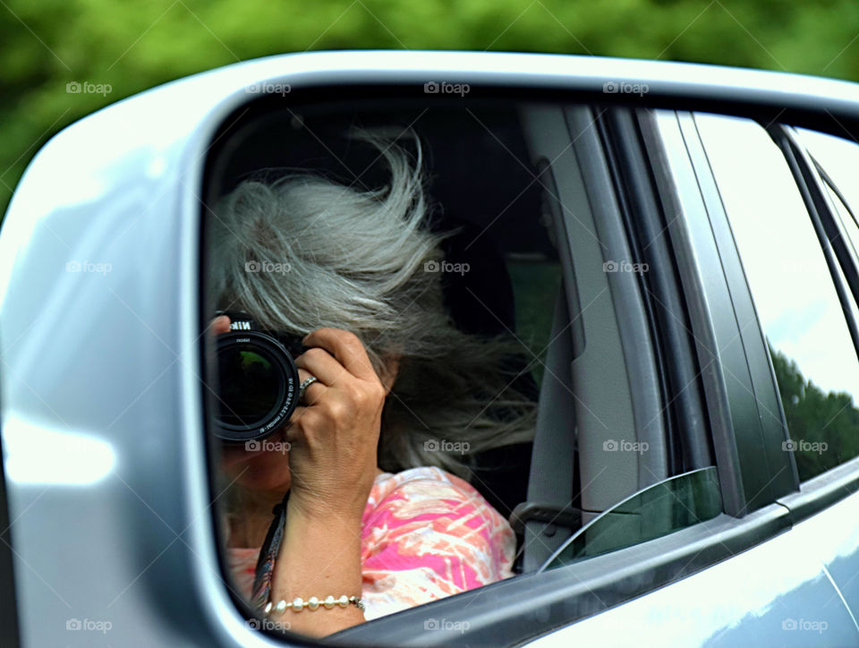 Woman taking pictures on camera