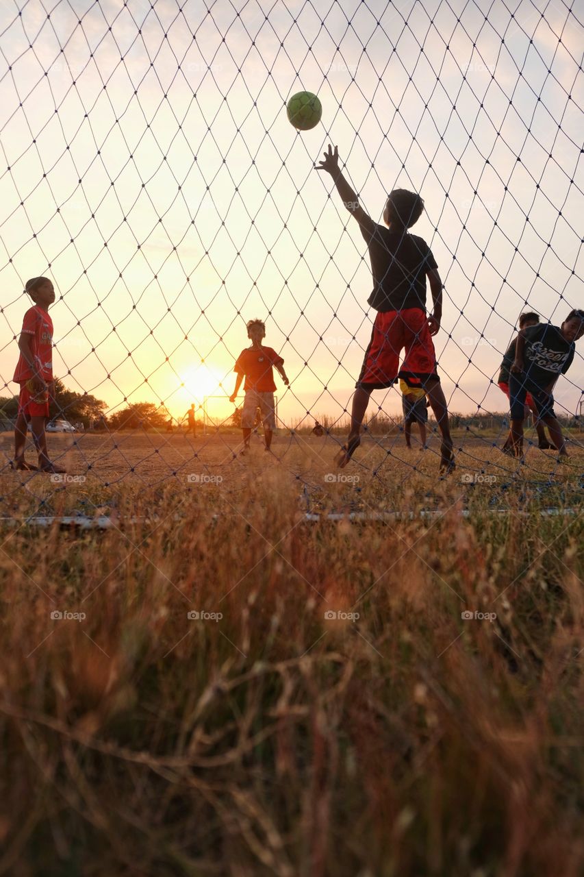 Playing football in the afternoon