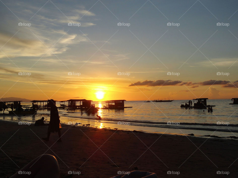 Scenic view of sea against orange sky