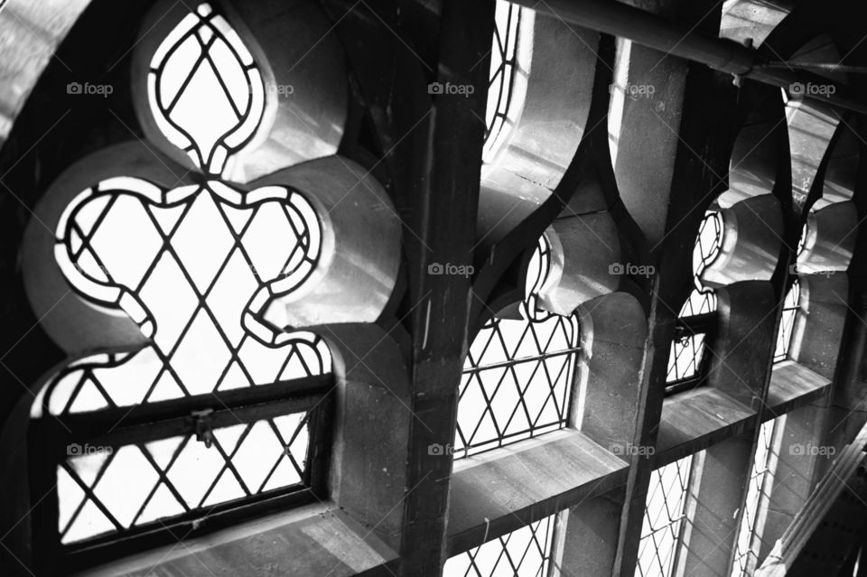 Light pouring in through the Tower Bridge in London, playing with light, black and white 