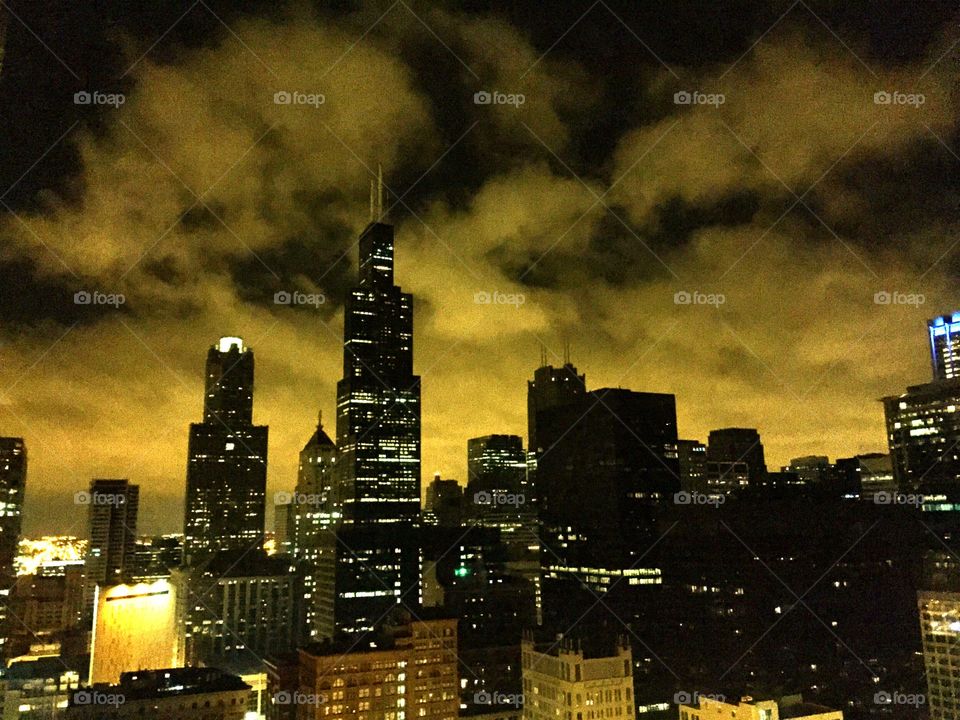 Yellow Chicago. Lights reflecting in the clouds