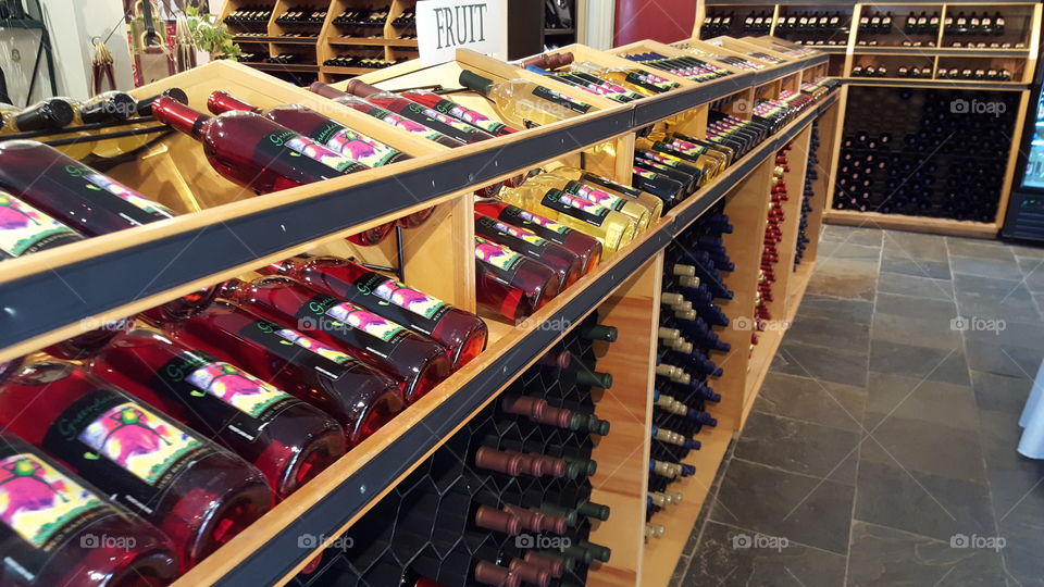 View of wine bottles waiting for purchase at a winery.