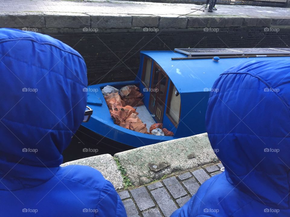 Inquisitive blue hoods observe blood boat - Regents Canal, London, UK