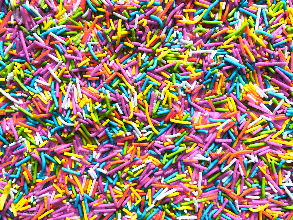 Background made of colorful pastel sugar sprinkles 