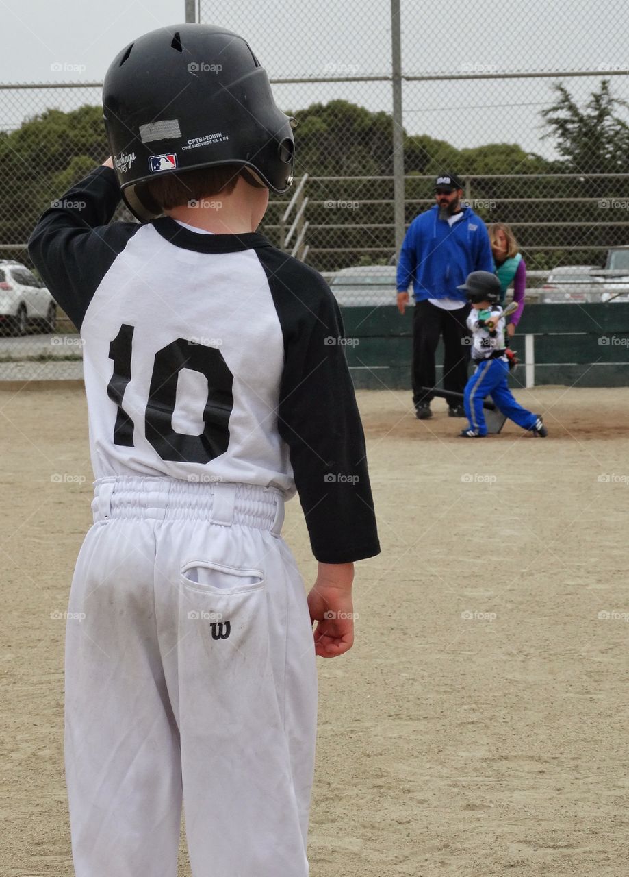 Little League Baseball. Young Kids Playing American Little League Baseball
