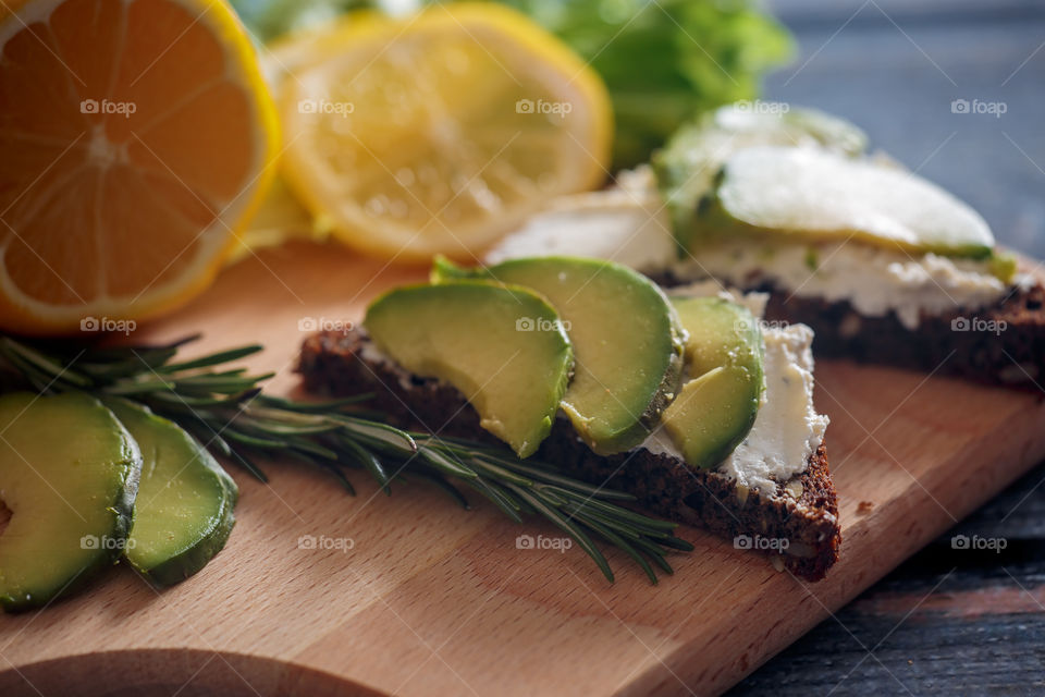 Dietary sandwiches with grain bread, cream cheese and avocado