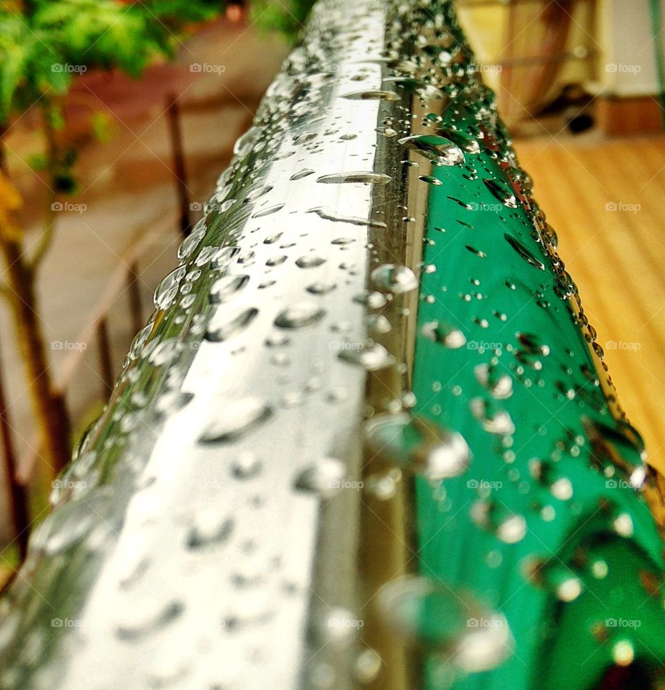 Water drops on metal railing