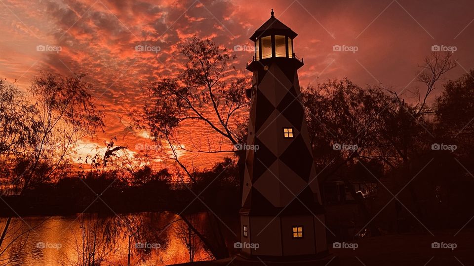 What fire rebuilding it’s self. The lighthouse cannot keep up with the fire. But darkness will prevail. It must it can’t go on Night must take over. 