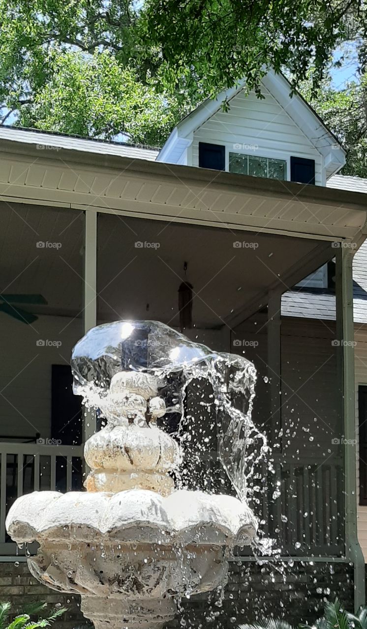 finding the white foap mission white fountain water blowing and splashing in the breeze White House in background