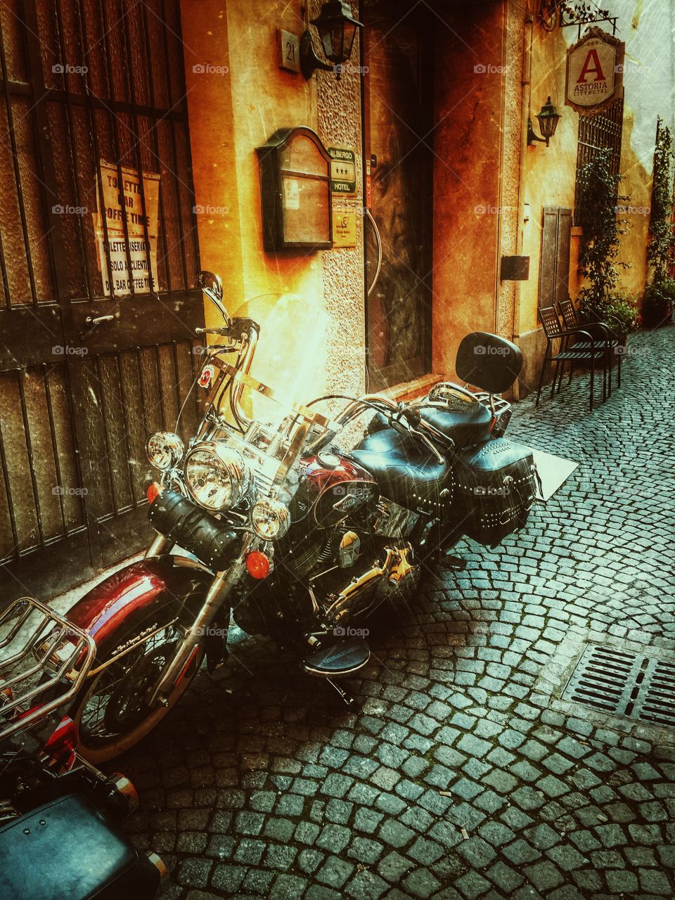 Harley davidson parked in an alley in Italy