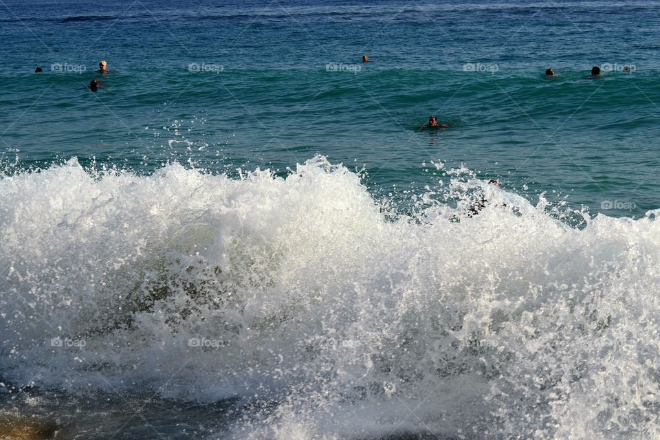 wave breaking against the shore