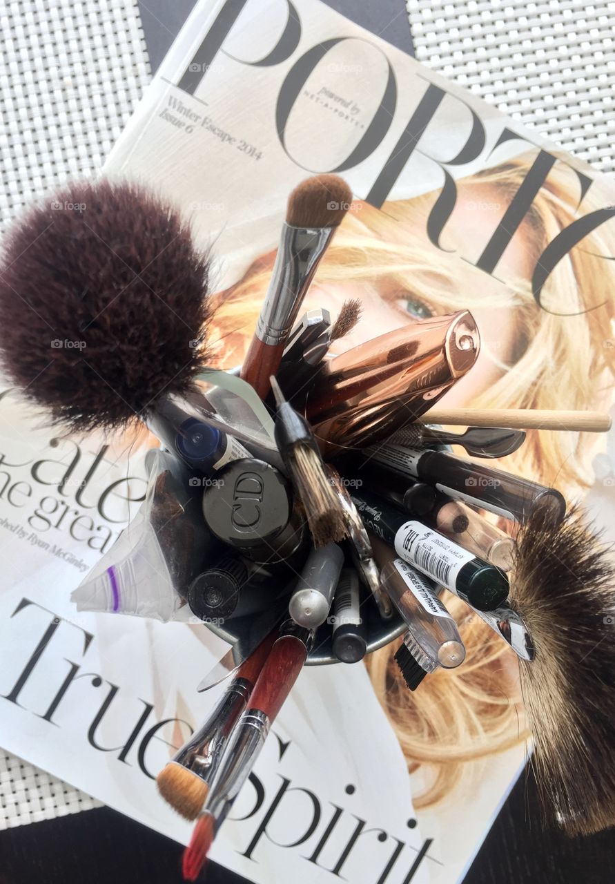 Make up brushes on the magazine
