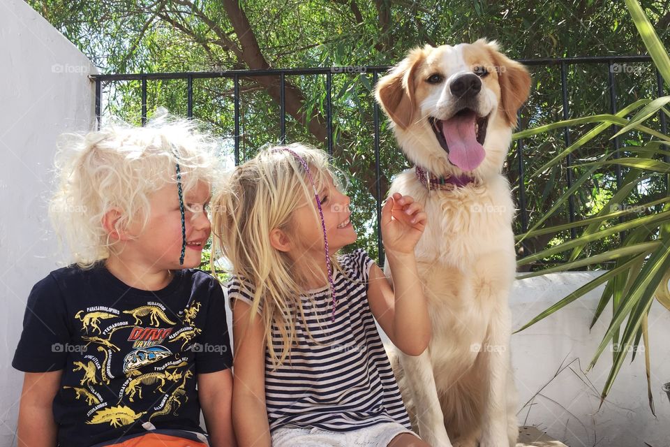 Kids with their puppy