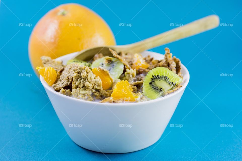 healthy breakfast. white bowl with cereals and fruits