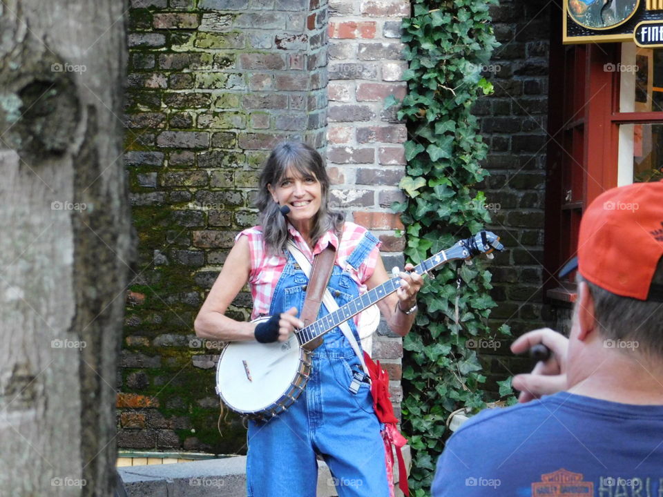 country woman folk singer on banjo