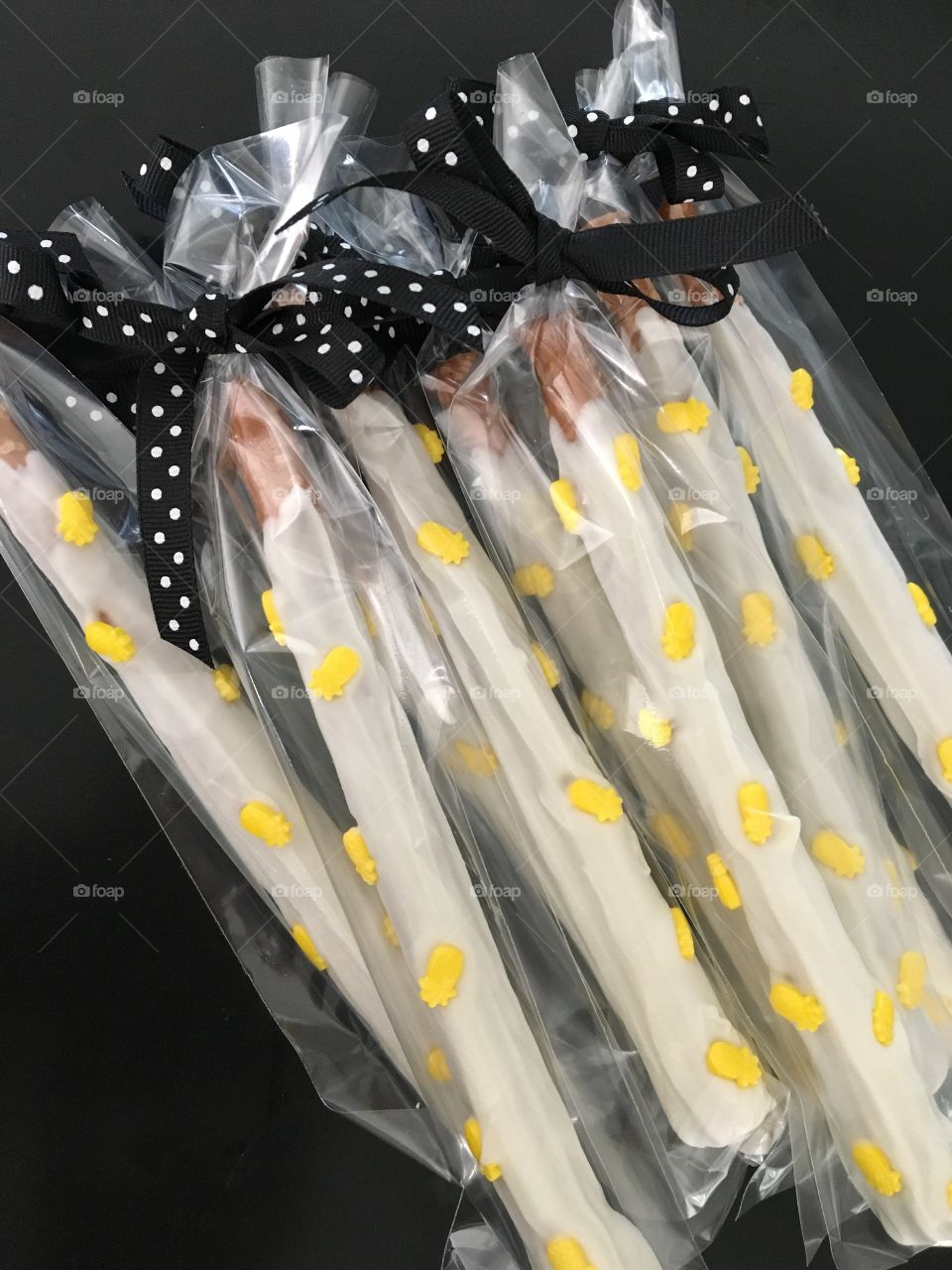 Pretzel Sticks in White Chocolate with Pineapple Sprinkles 