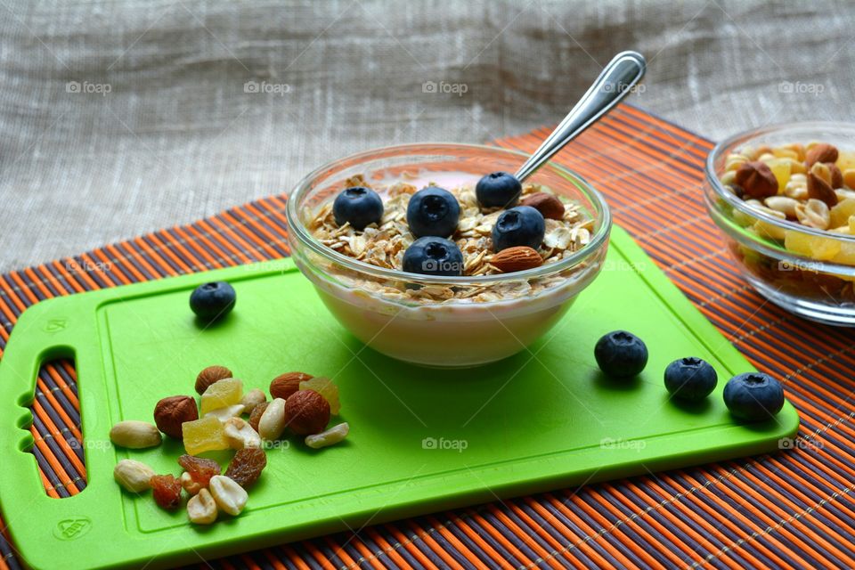 tasty healthy food oat with nuts and berries table background