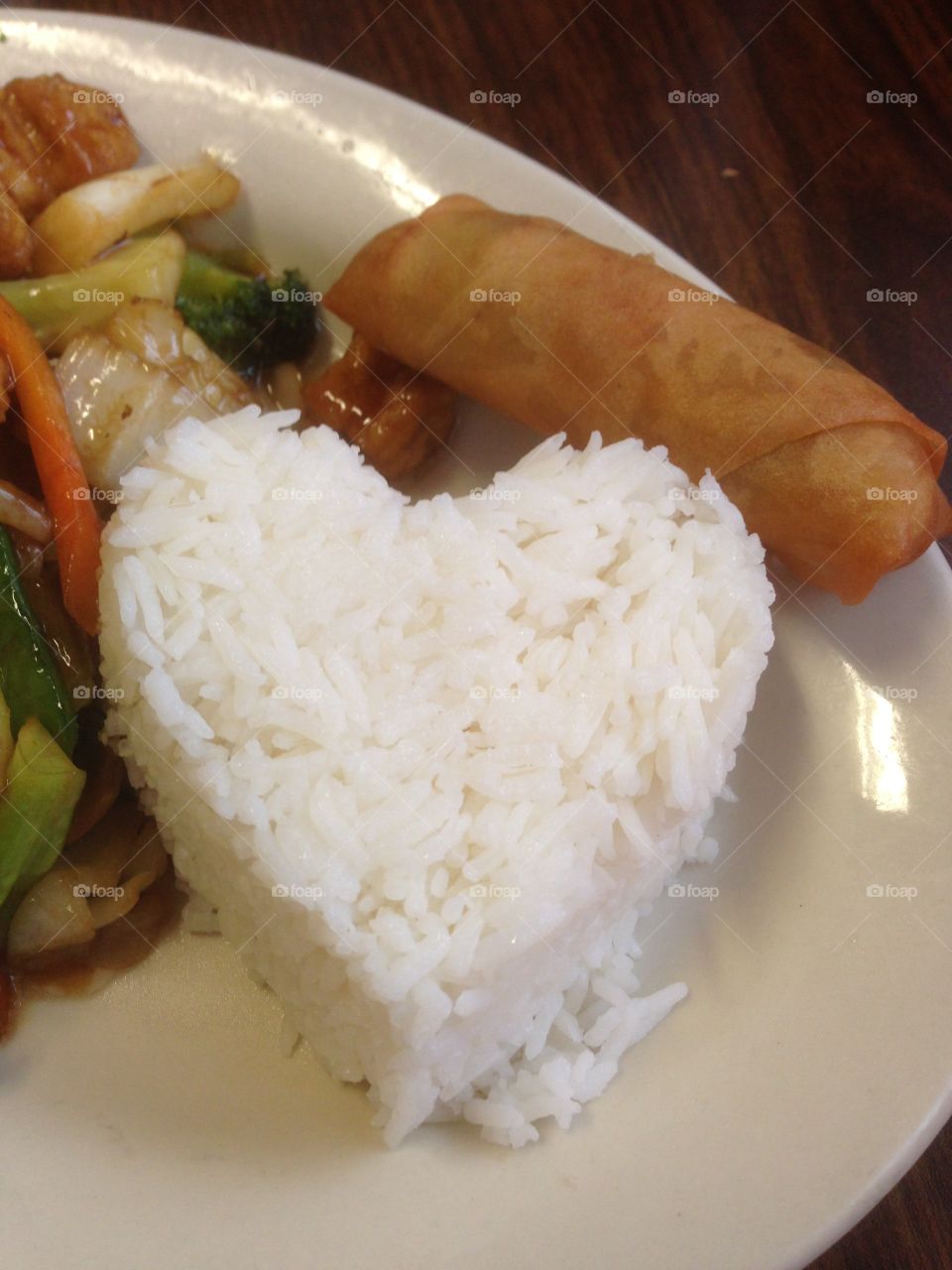 Heart shaped white rice with stir fry and egg roll, sticky rice, Asian food, Chinese food