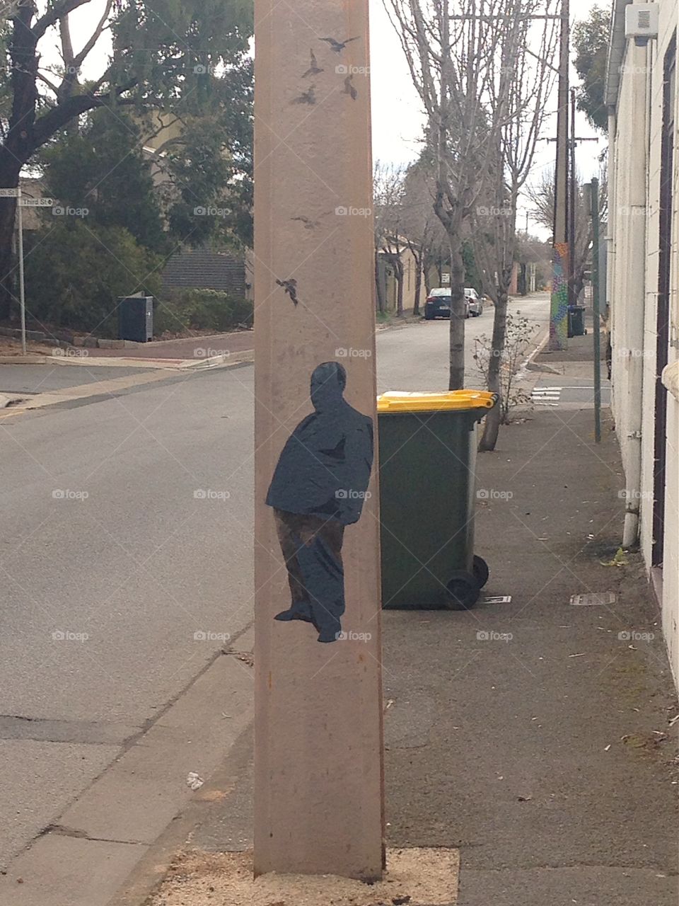 Art on old neighbourhood post. Artists are invited, in this Adelaide, S.Australia neighbourhood to create art on its lamp/electrical posts to beautify