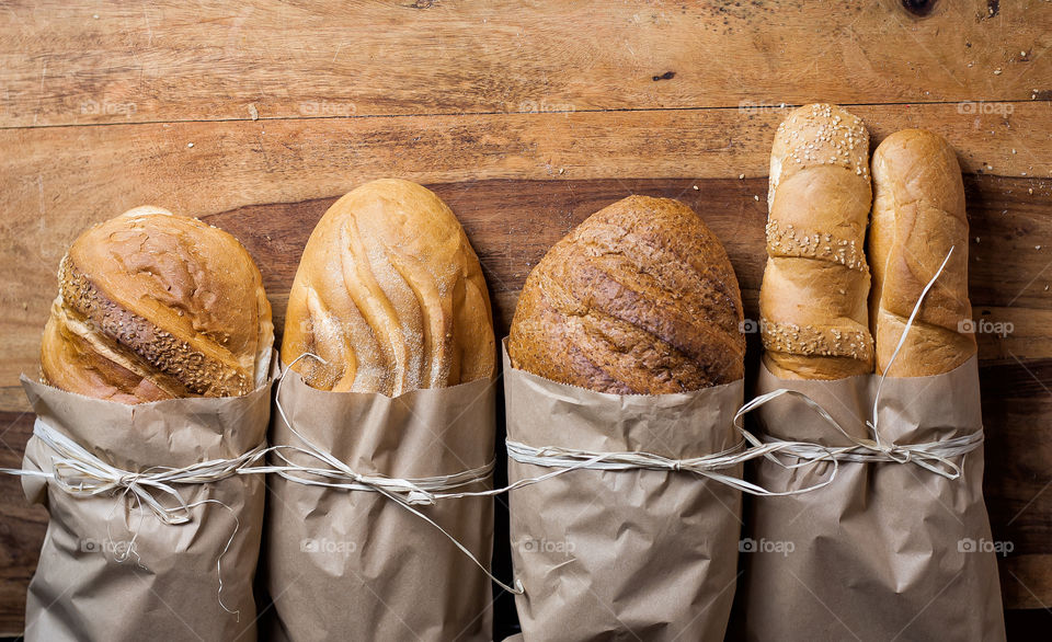 different bread in paper bags