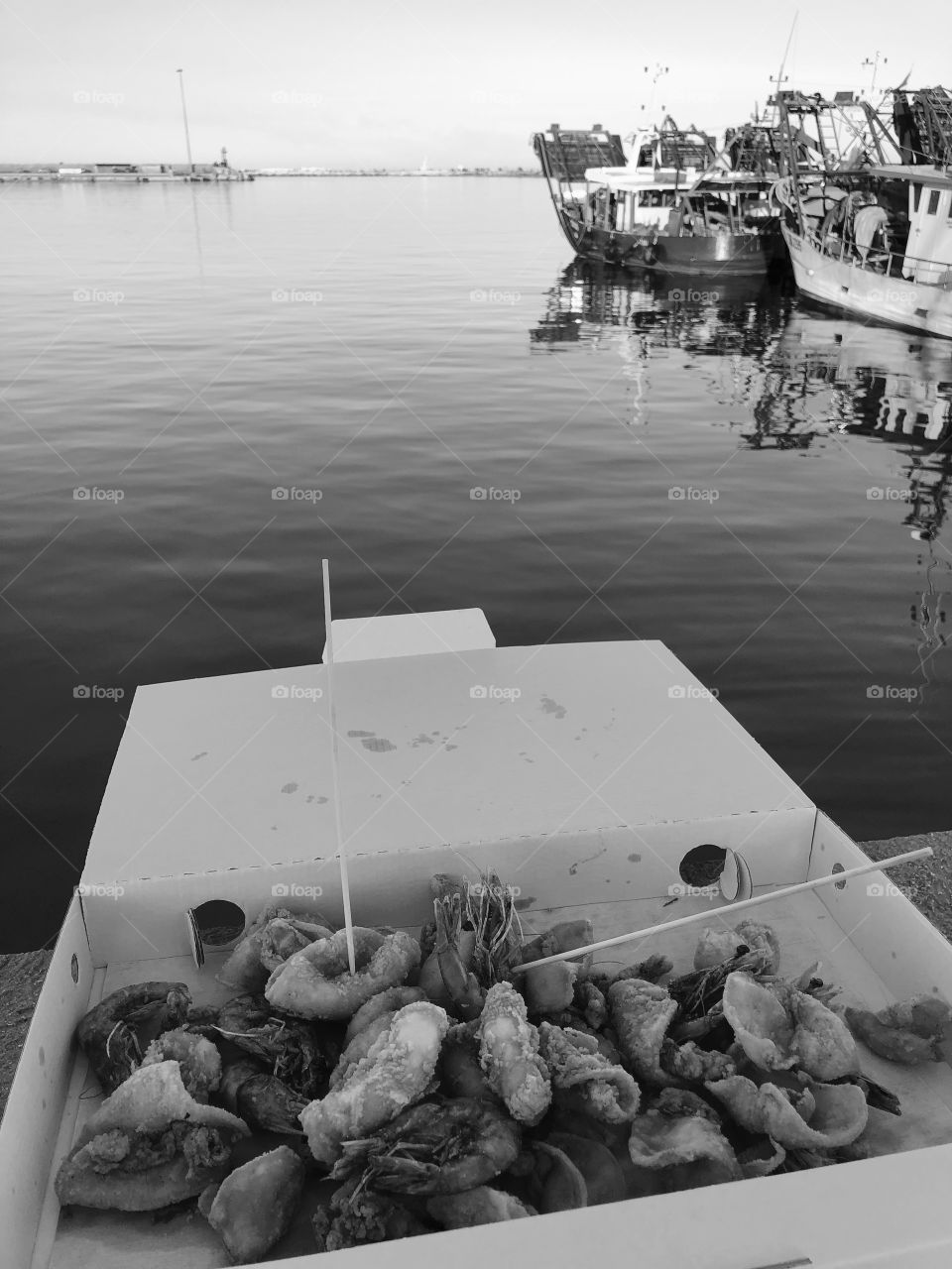 Fried fish snack with harbour view