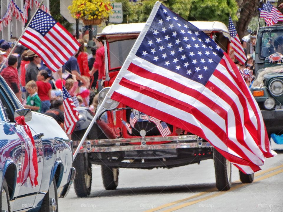 American Pride. Vintage Automobiles In American Independence Day Parade

