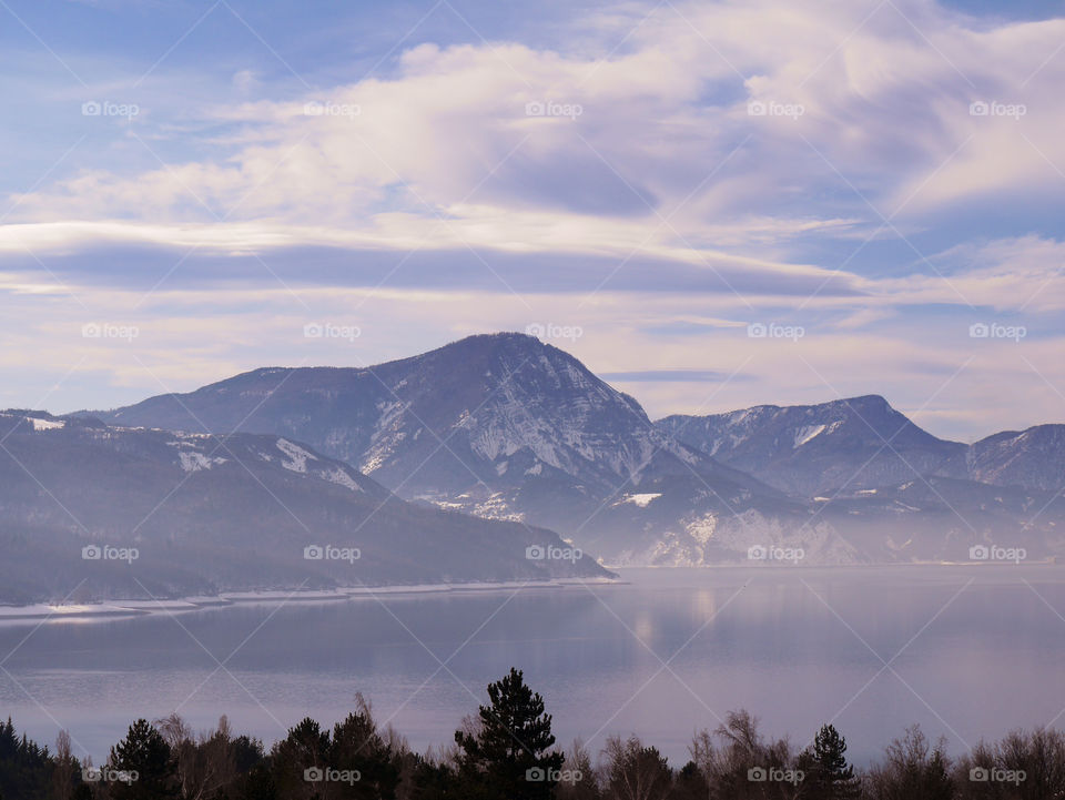 Scenic view of a mountains against cloudy sky