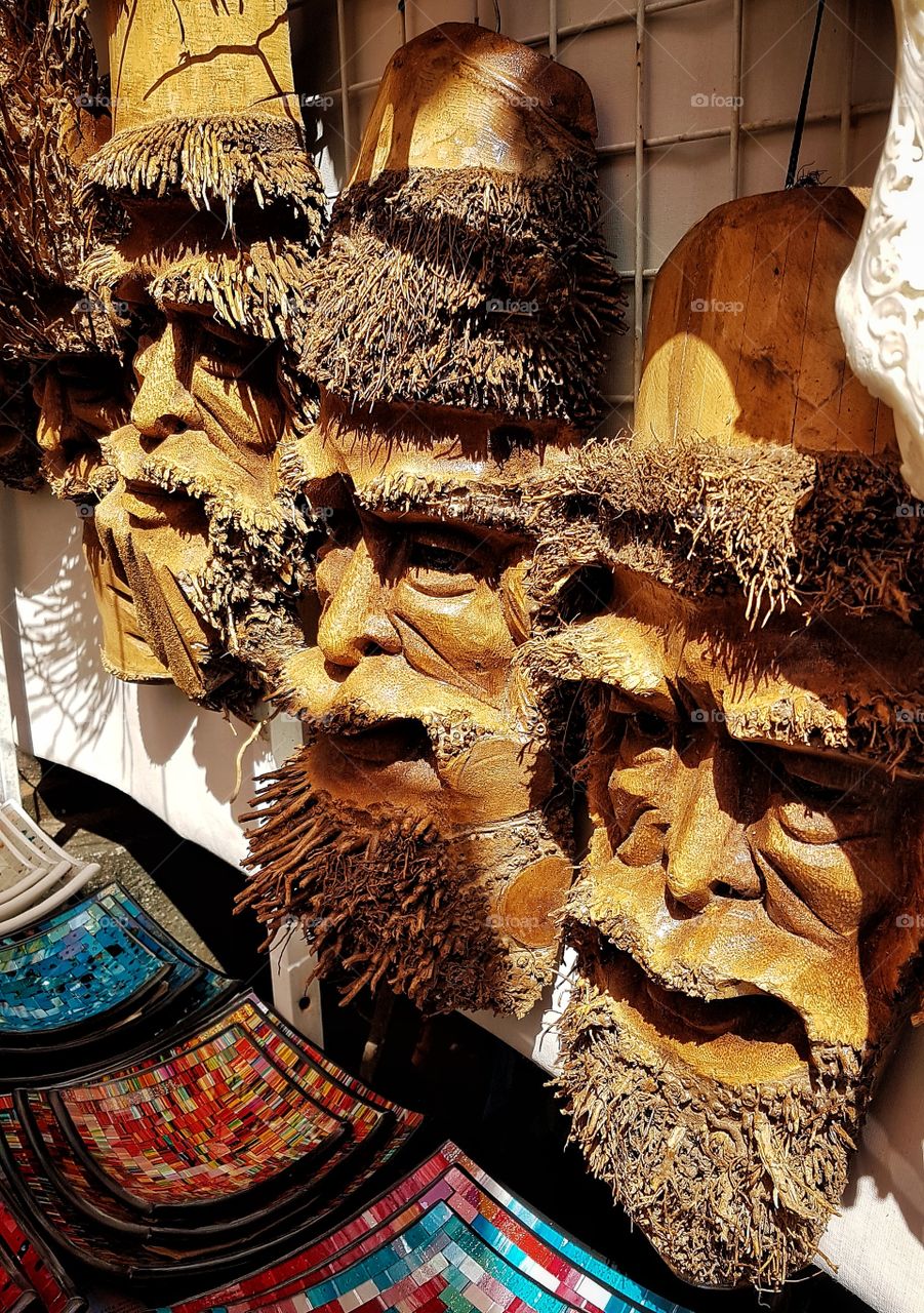 carved faces in bali, idonesia