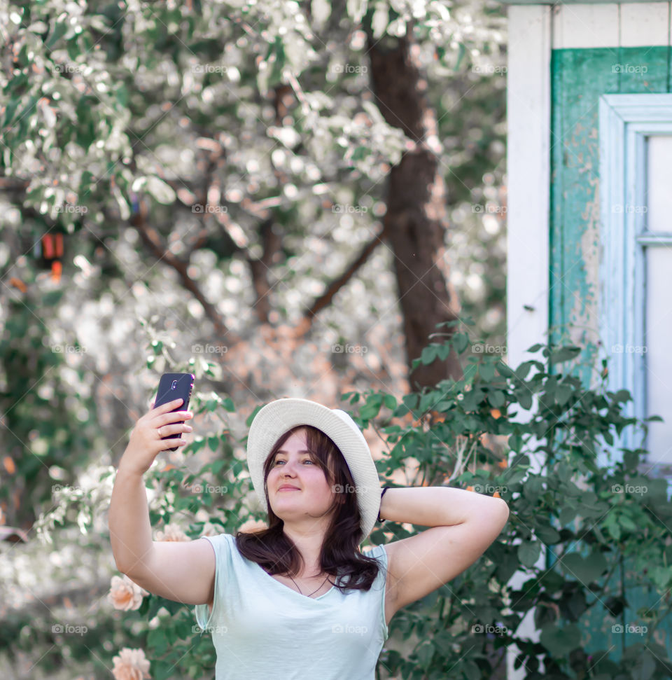 One young woman take selfie at the countryside.