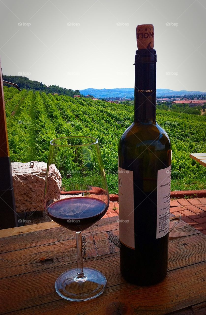 An afternoon glass of wine at Le Pignole vineyard, Brendola, Italy