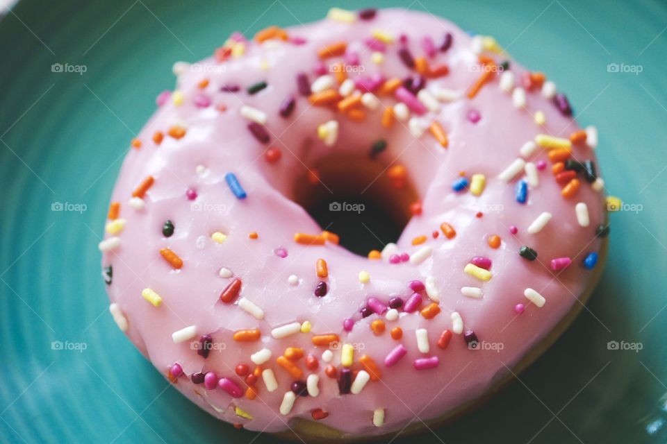 Closeup Of A Pink Frosted Donut With Sprinkles, Food Photography 