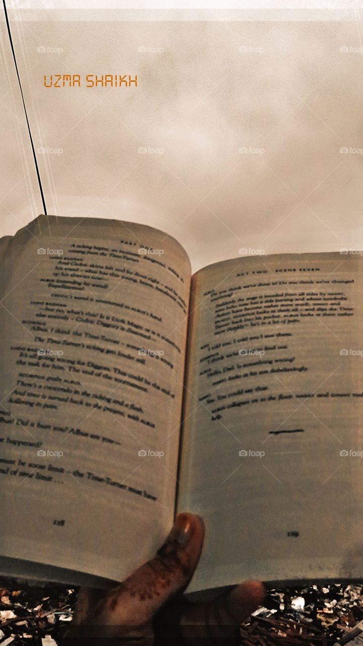 That open book being held looks like a gateway to a world of knowledge and imagination! Books have a way of taking us on incredible journeys without ever leaving our seats. 📖✨