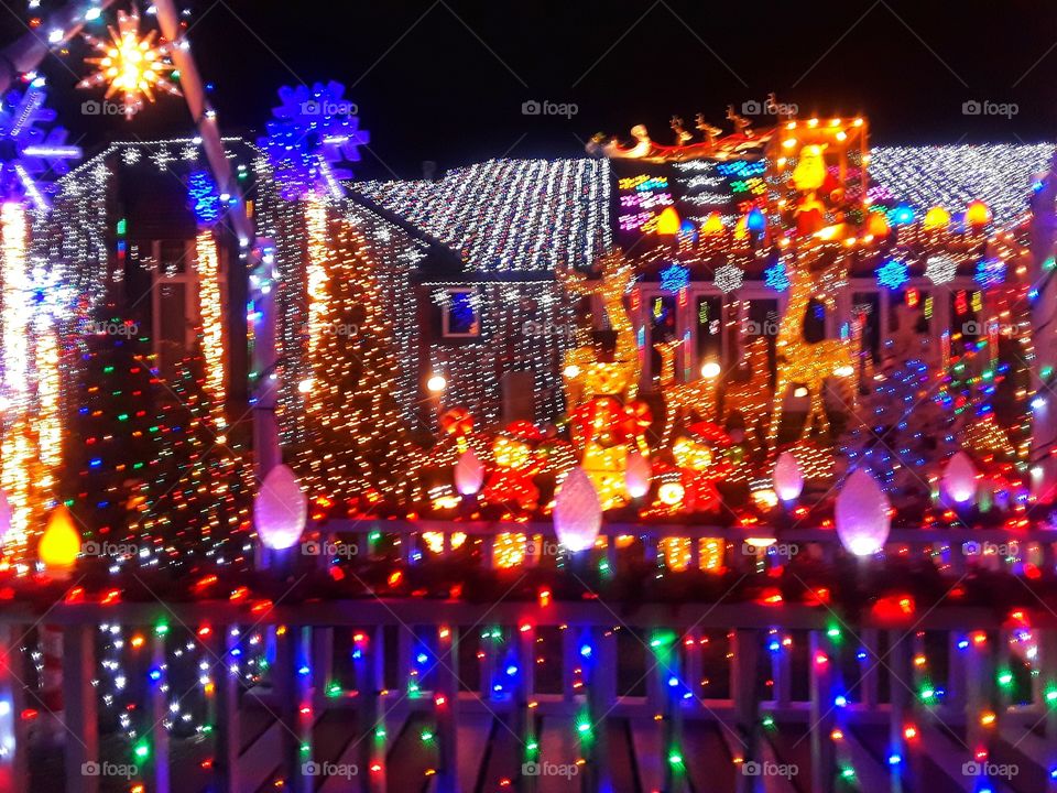 Holiday Lights Covering House and Yard Christmas Light Display