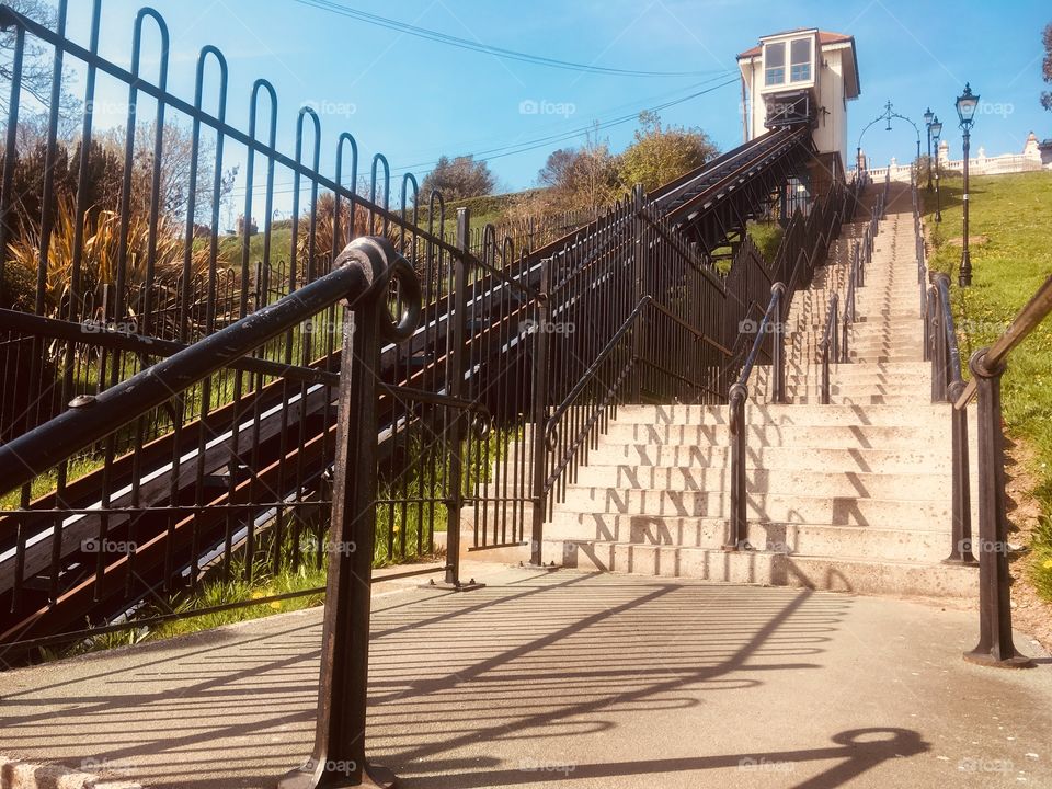 Cliff lift train and track, stairs and railings at Southend, Essex, in Spring. 