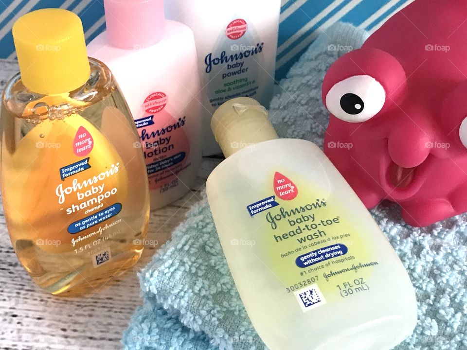 Johnson & Johnson’s baby lotion, wash, shampoo, and powder side flat lay 