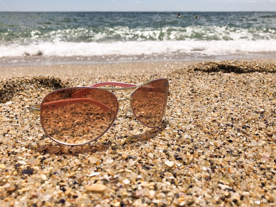 glasses on the sand