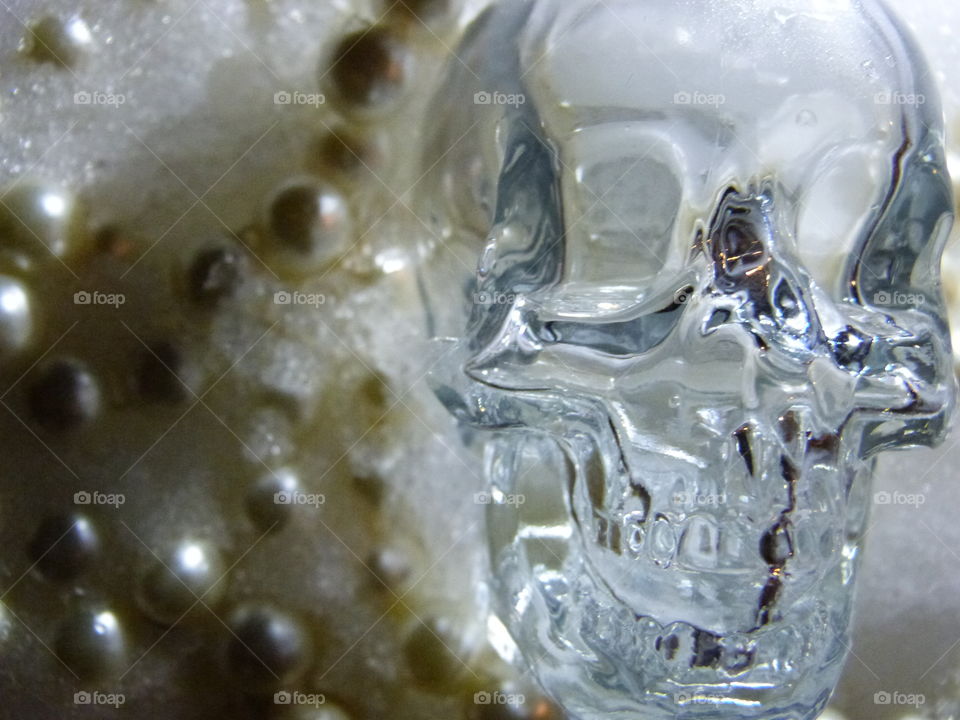 crystal skull in snow and pearls