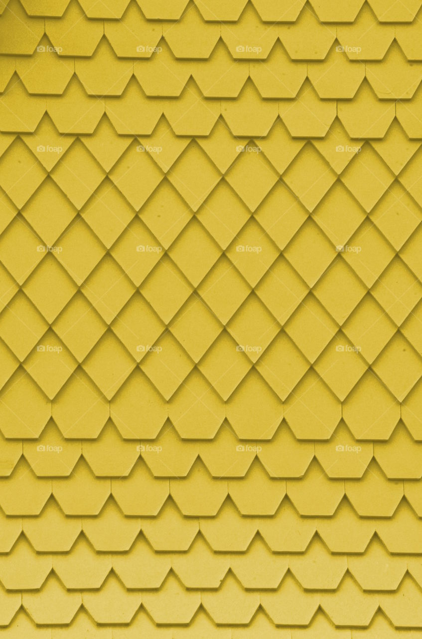 Very yellow siding on a Victorian home