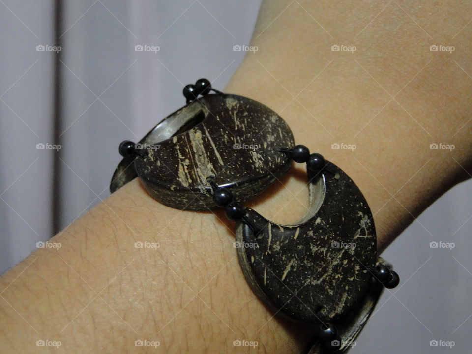 wrist with handmade wooden bracelet