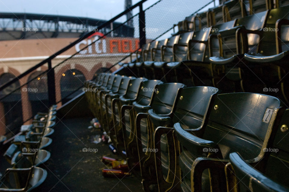 The seats of Shea stadium after the final game before it was torn down looking over at the new citi field 
