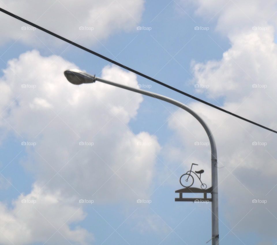 The street lights are decorated with bicycle shapes