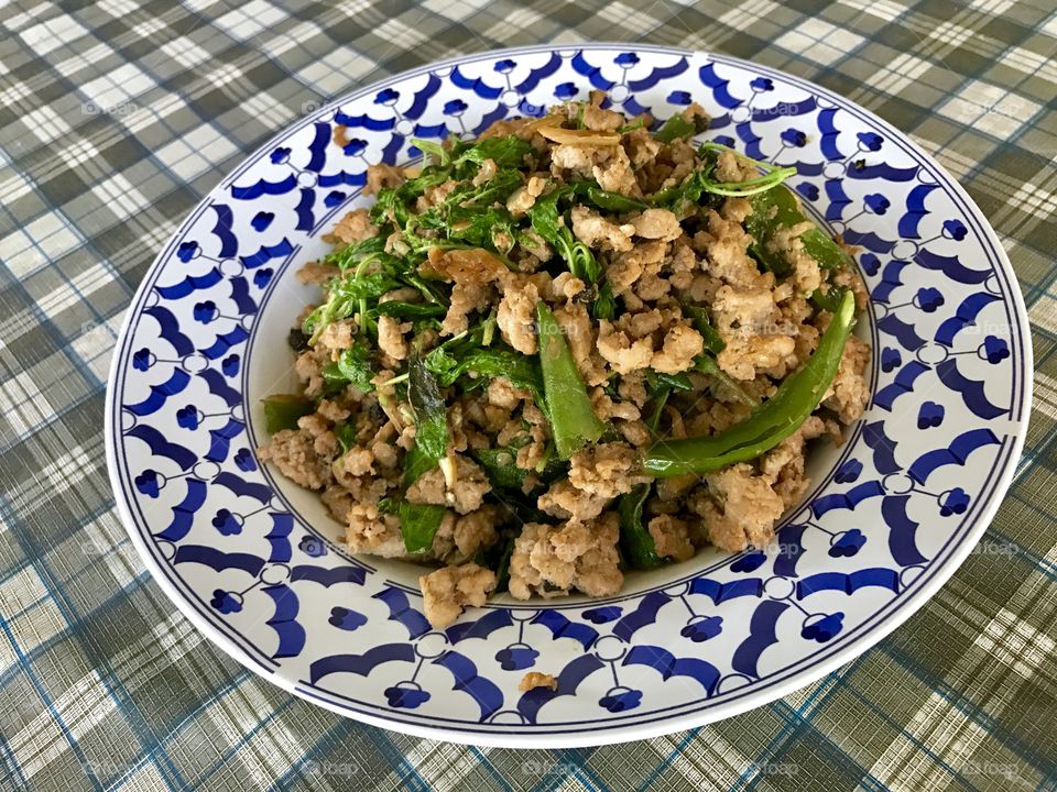 Stir fried minced pork with chili and basil leaves