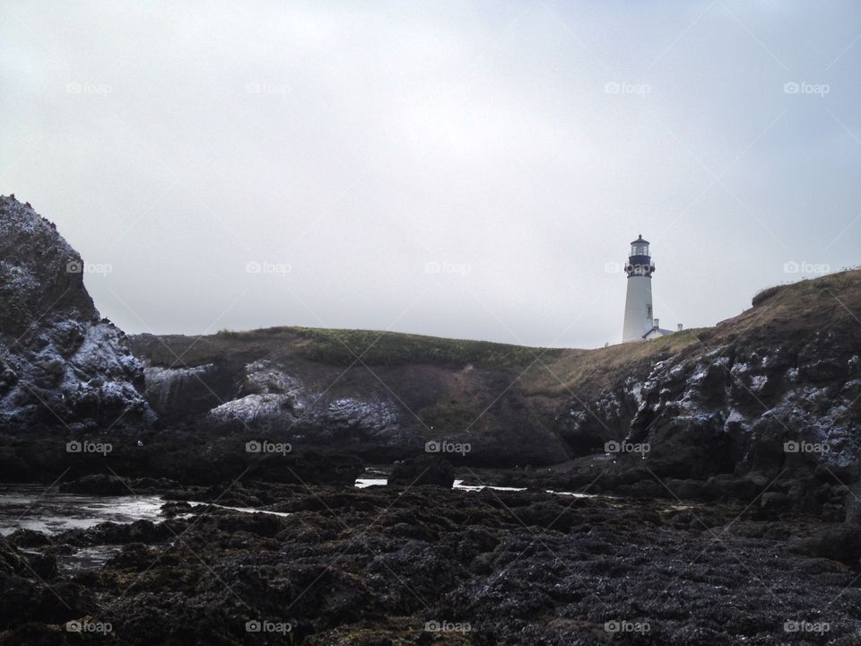 Yaquina Head Lighthouse . Taken from the tide pools near by while on vacation.