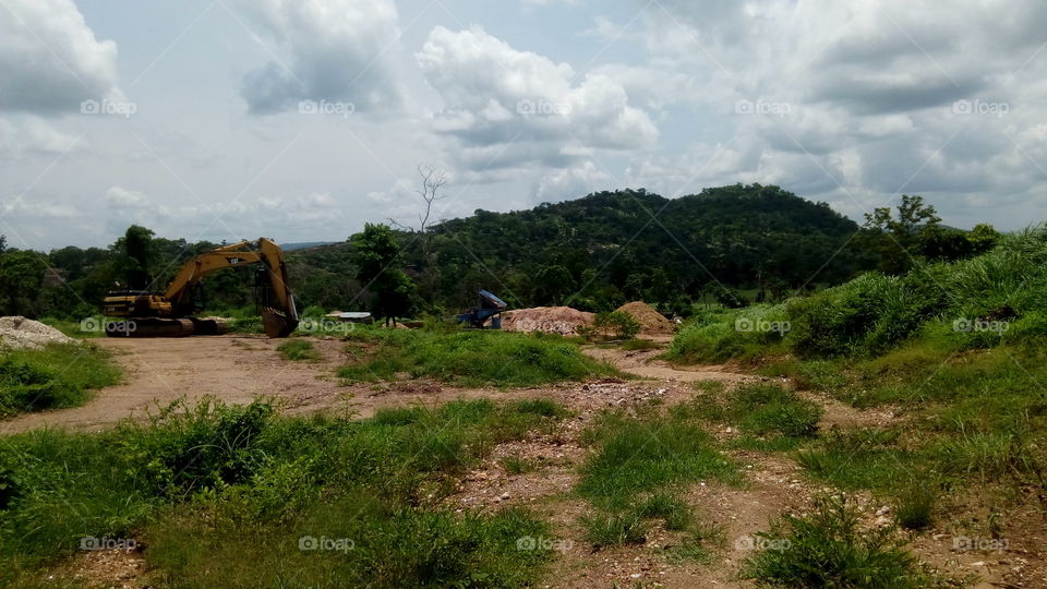 mining site from a distance, excavator for mining,  mineral washing machine