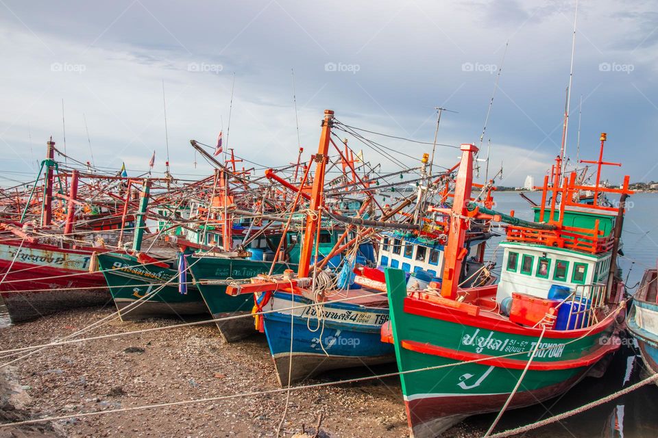 Thai Fisherman's boats at a fishing Pier in Thailand Southeast Asia
