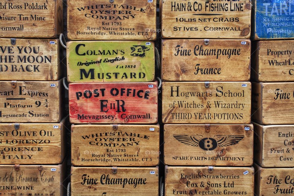 Abstract Wooden boxes stamped with popular adverts and commercials.