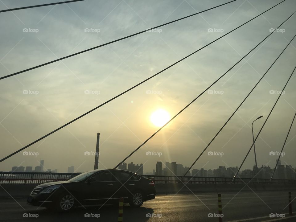 At the bridge looking the sun