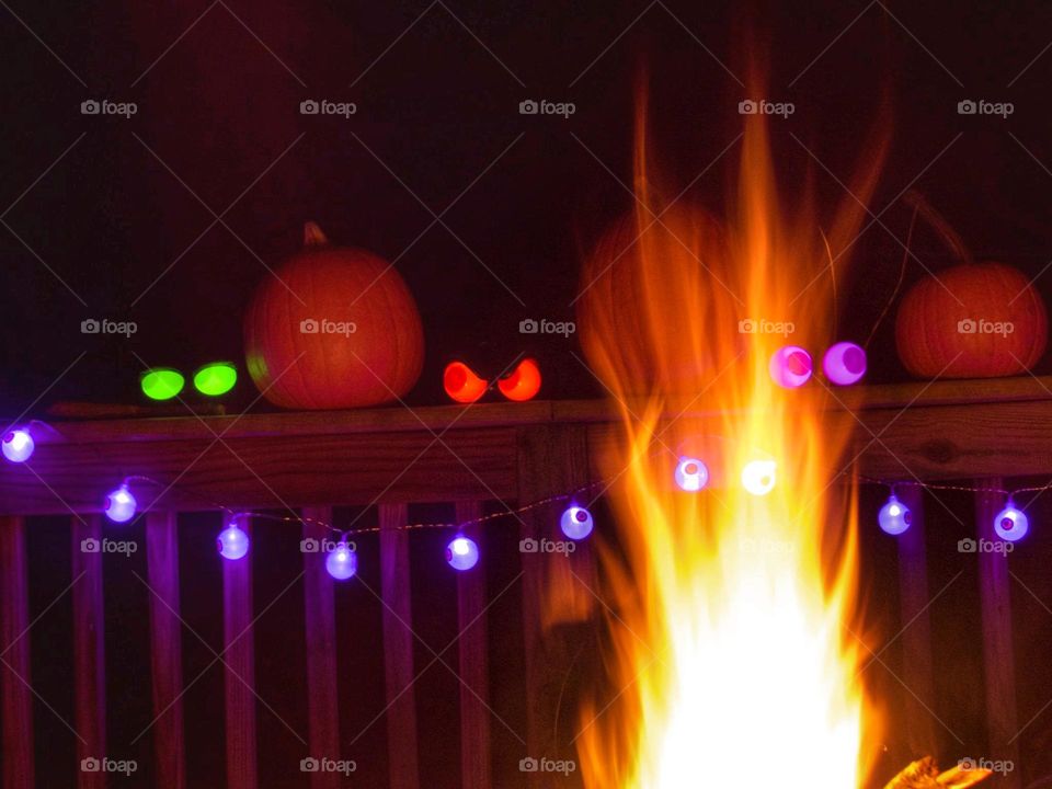 Spooky Halloween deck decorations with a fire