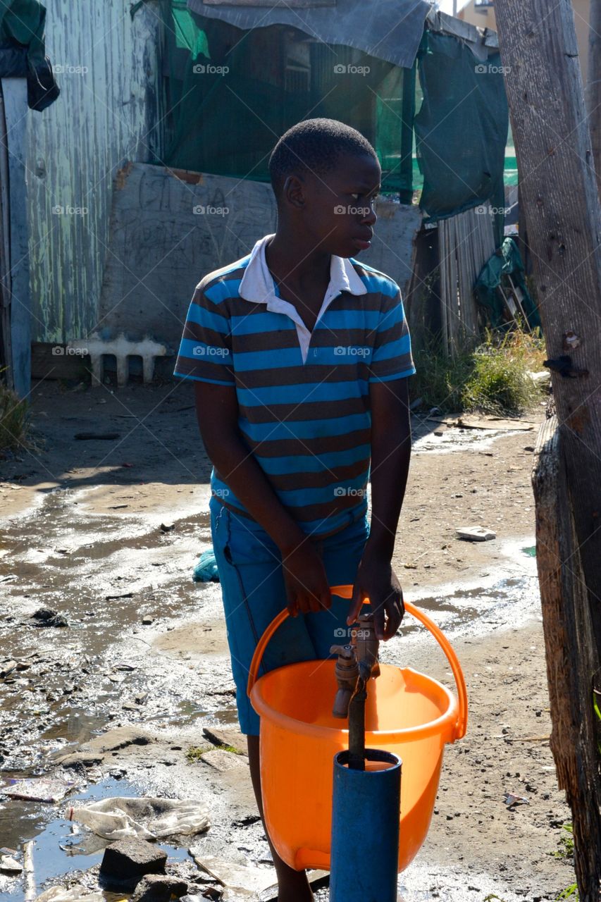 Getting water in South African township 