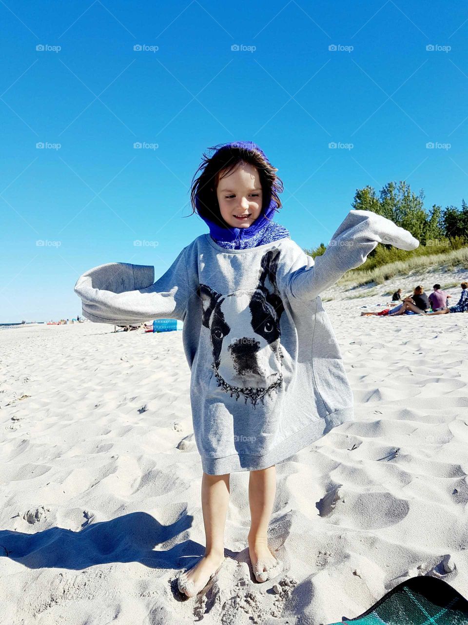 Girl playing on the beach